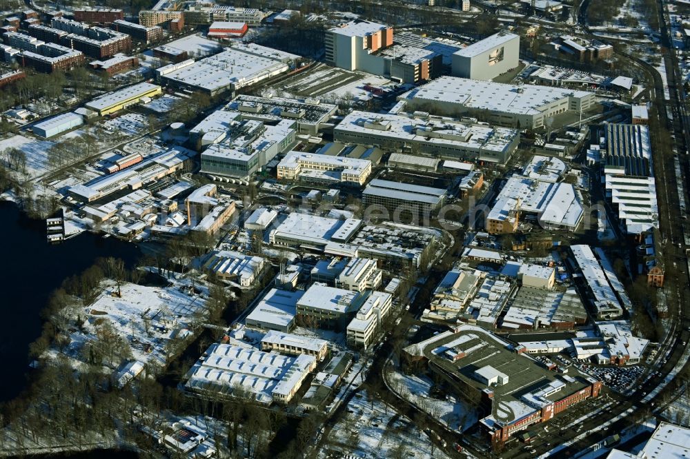 Berlin from the bird's eye view: Wintry snowy factory area of the Bayerische Motoren Werke / BMW AG motorcycle plant at the Juliusturm in the district of Spandau in Berlin, Germany