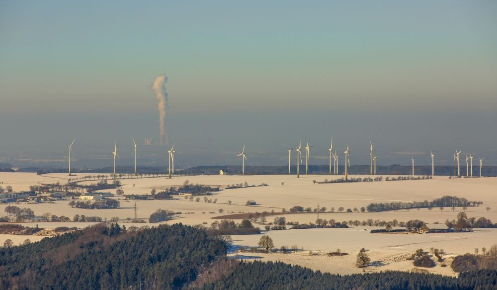 Aerial image Rüthen - Wintry snowy Wind turbine windmills on a field in the district Kallenhardt in Ruethen in the state North Rhine-Westphalia
