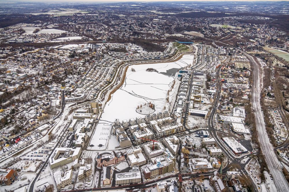 Dortmund from the bird's eye view: Wintry snowy residential area of the multi-family house Settlement at shore Areas of lake Phoenix See in the district Hoerde in Dortmund at Ruhrgebiet in the state North Rhine-Westphalia, Germany