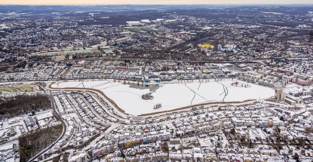 Dortmund from the bird's eye view: Wintry snowy development area on lake Phoenix See in Dortmund at Ruhrgebiet in the state North Rhine-Westphalia