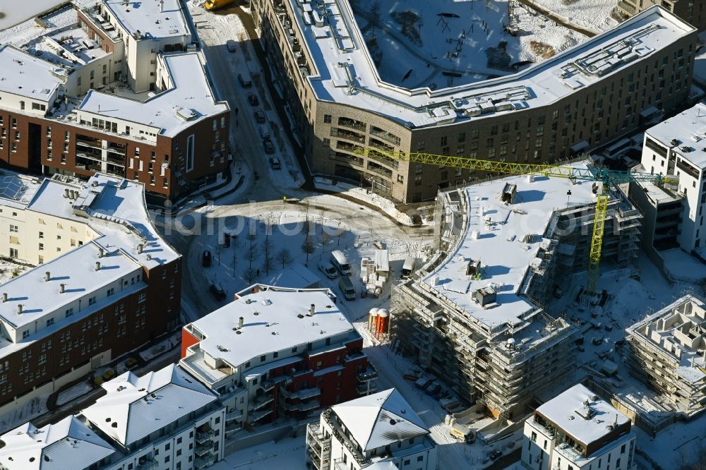 Aerial photograph Rostock - Wintry snowy apartment building settlement on the wooden peninsula in Rostock in the state Mecklenburg-Western Pomerania, Germany