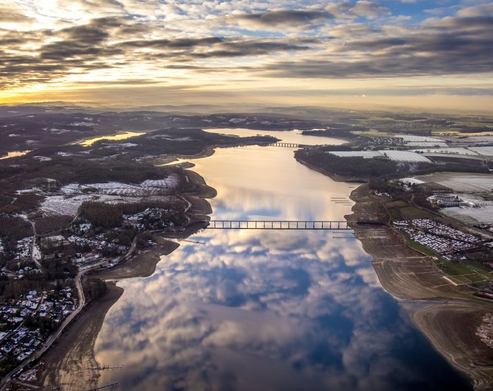Aerial image Südrandweg - Wintry snowy cloud reflection on the water surface of the lake Moehnesee in Suedrandweg in the state North Rhine-Westphalia, Germany