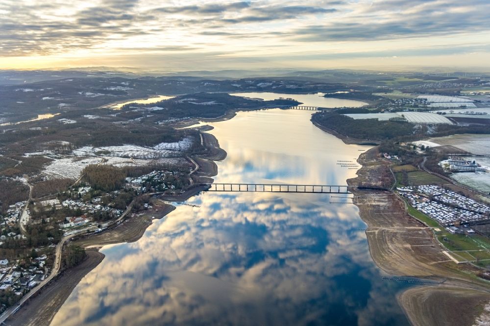 Südrandweg from above - Wintry snowy cloud reflection on the water surface of the lake Moehnesee in Suedrandweg in the state North Rhine-Westphalia, Germany