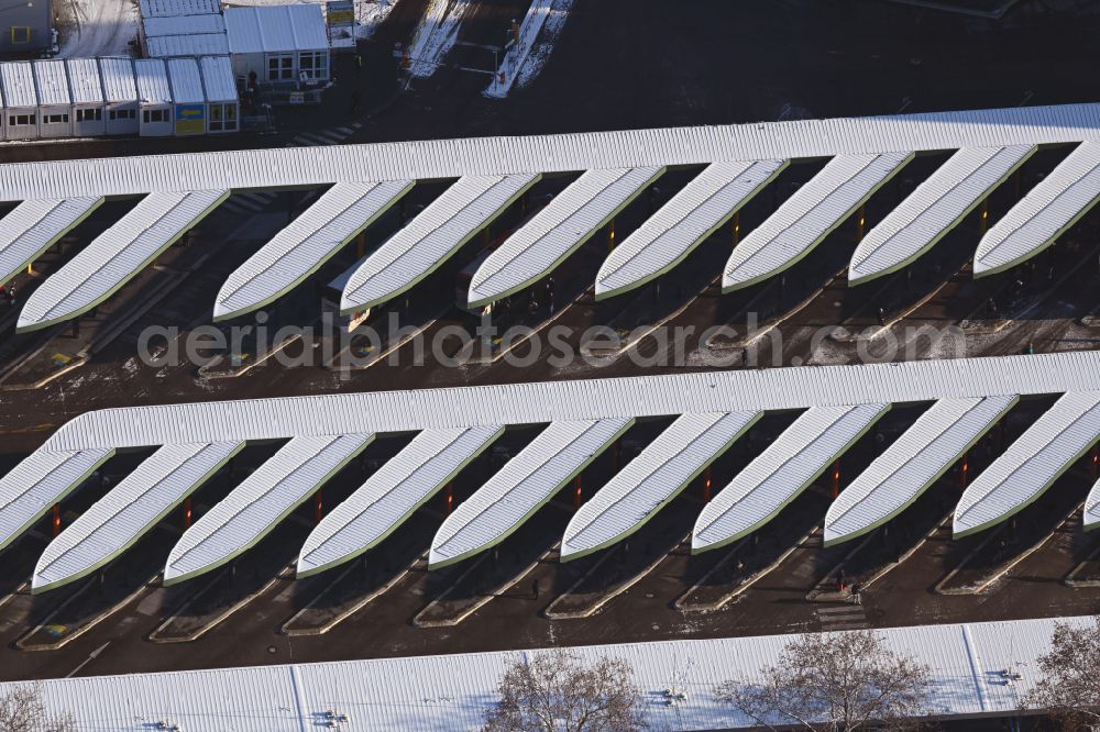 Aerial photograph Berlin - Wintry snowy central Bus Station for Public Transportation on Masurenallee in the district Westend in Berlin, Germany