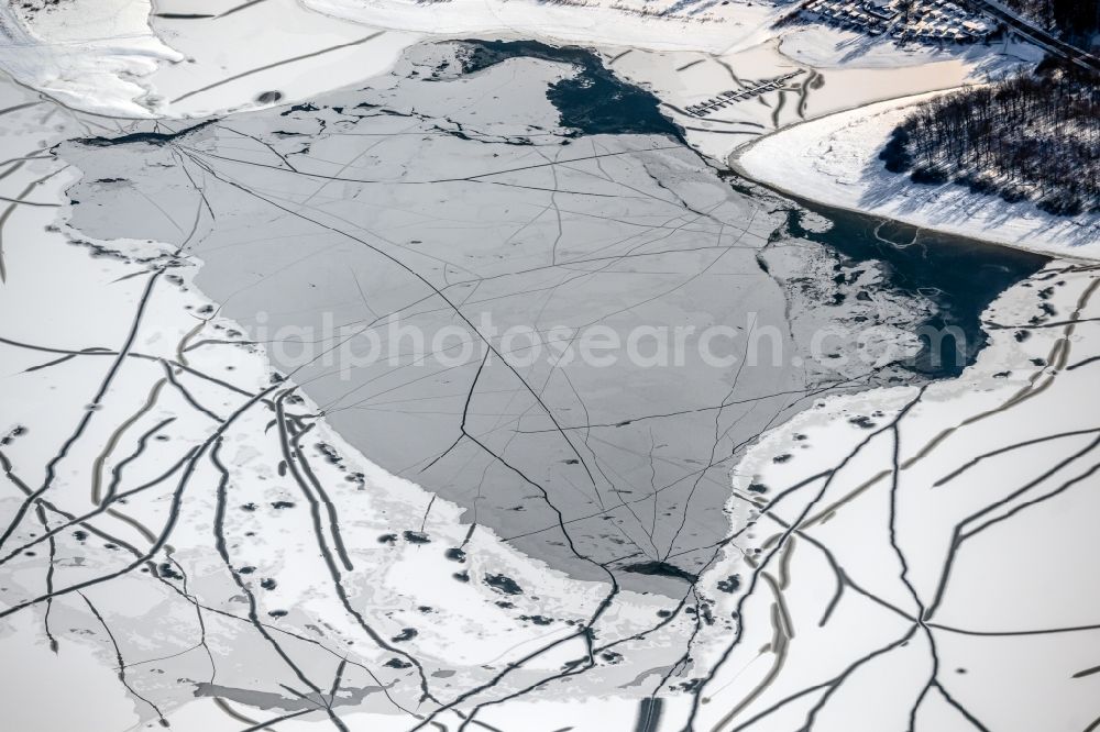 Möhnesee from above - Winter snow-covered reservoirs and shore areas at the frozen reservoir Moehnsee in Moehnesee in the Sauerland in the state of North Rhine-Westphalia, Germany