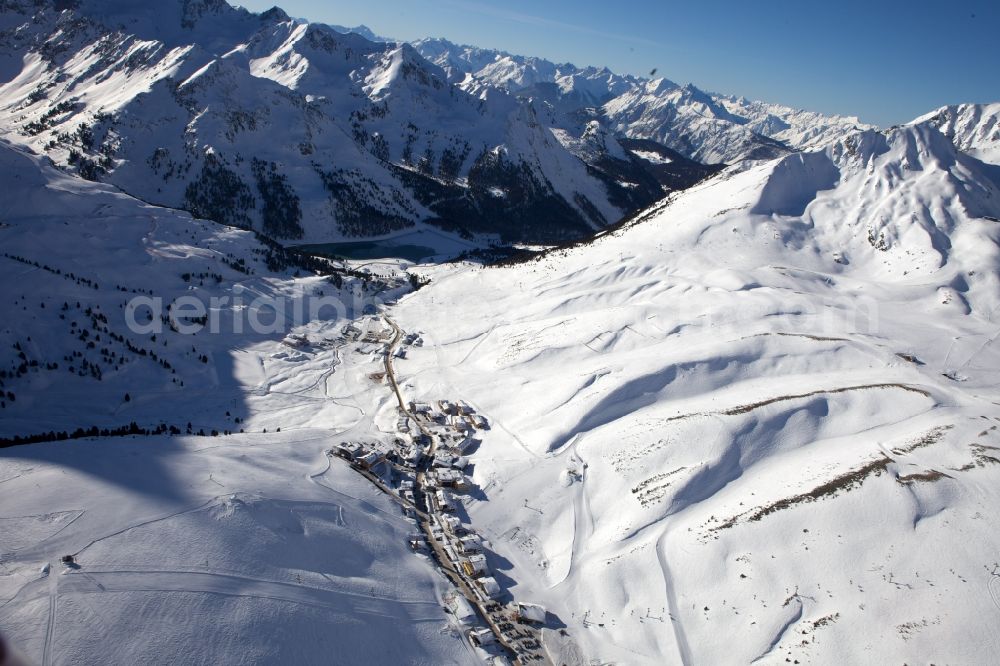 Aerial image Silz Kühtai - Wintry landscape with snow covered Alps in Kuehtai in Silz in Tyrol, Austria
