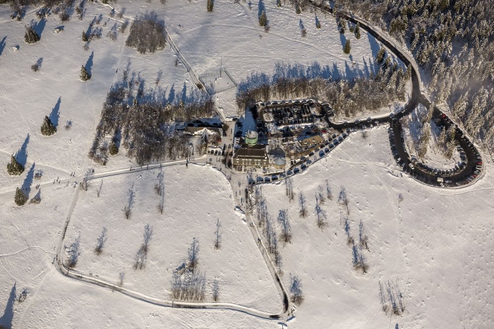 Aerial photograph Winterberg - Winter - View of the snow-covered mountain Kahler Asten with a weather station, the tower called Astenturm and an affiliated hotel and restaurant with the name Berggast Hotel Kahler Asten near by Winterberg in the state of North Rhine-Westphalia