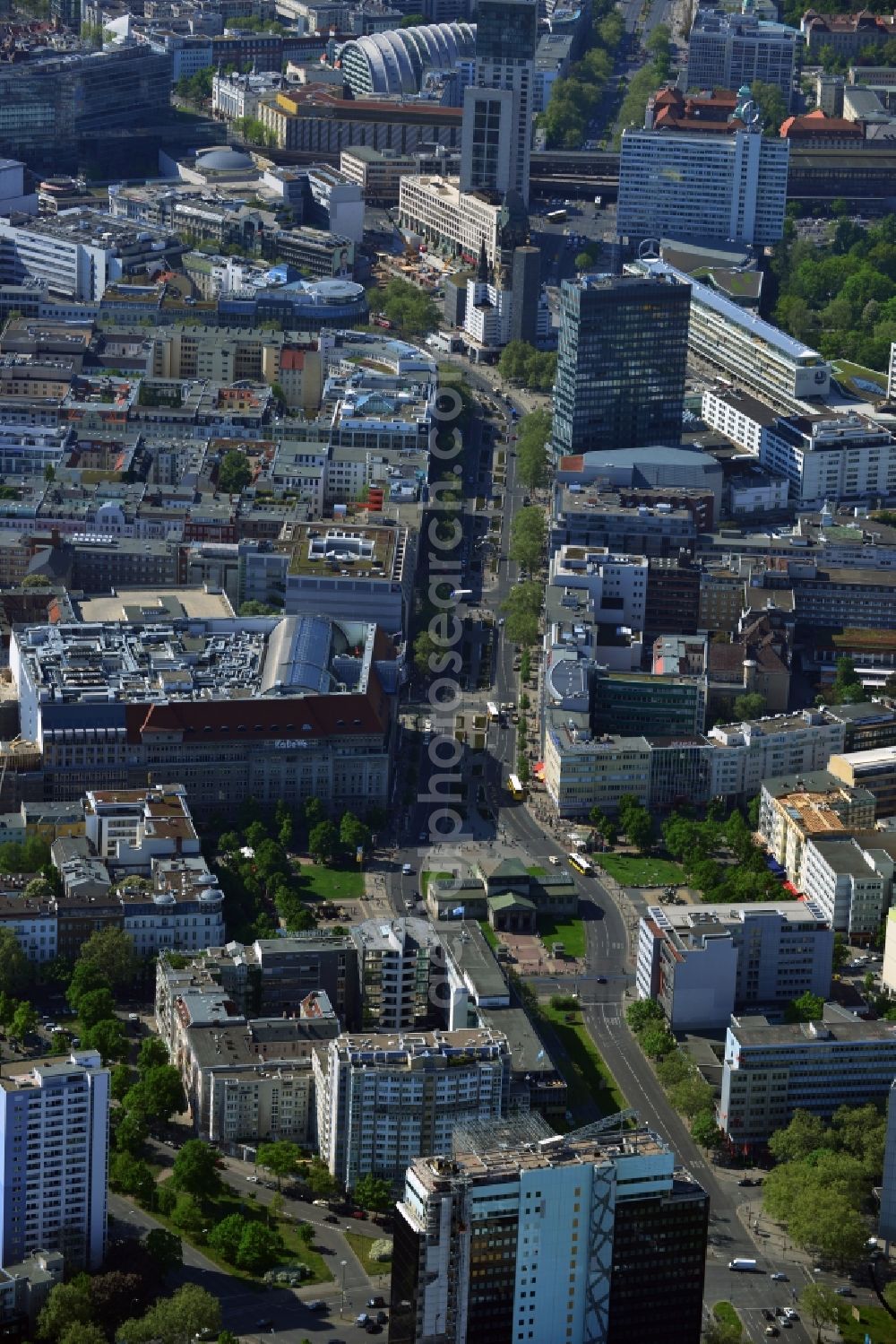 Aerial photograph Berlin - Tauentzienstrasse connects the Wittenberg Platz in Schoeneberg district with Breitscheidplatz in the Charlottenburg district. This stretch of road is the hip business district of the City West. Known is the department store KaDeWe. More Buying house and textile goods chains have their branches here. The Europe Center forms the western end at Breitscheidplatz. There the Emperor Wilhlem Memorial Church, the skyscraper Zoofenster with the luxury Waldorf Astoria Hotel