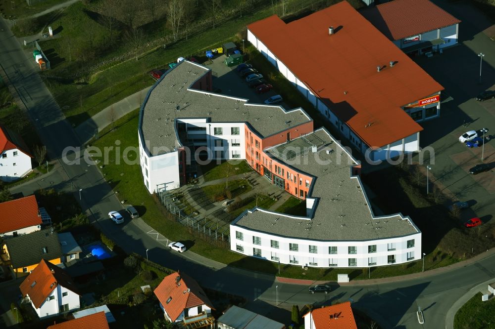 Gebesee from the bird's eye view: Residential and commercial building district along Hasslocher Strasse - Siedlungsweg in Gebesee in the state Thuringia, Germany