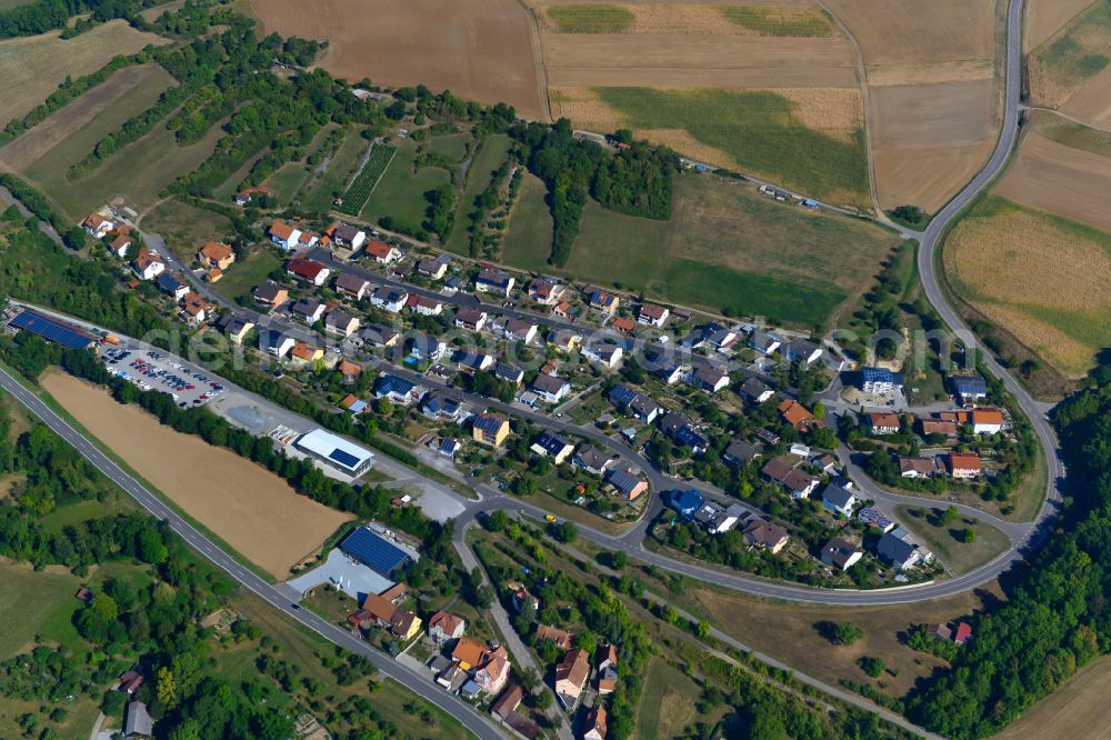 Aerial photograph Bieberehren - Single-family residential area of settlement on the edge of agricultural fields in Bieberehren in the state Bavaria, Germany