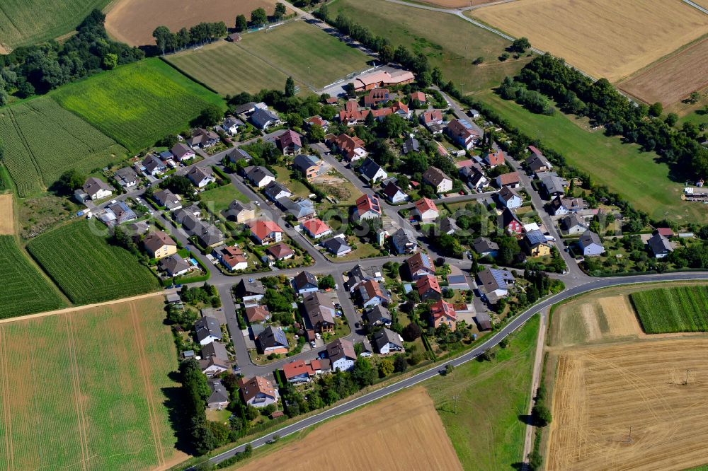 Burggrumbach from above - Single-family residential area of settlement on the edge of agricultural fields in Burggrumbach in the state Bavaria, Germany