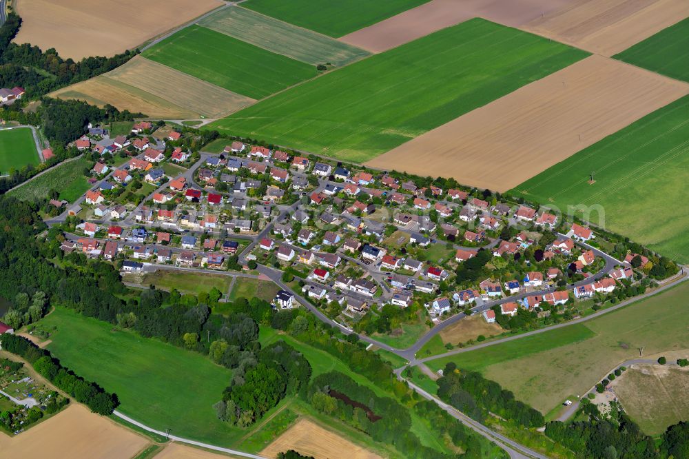 Gaukönigshofen from above - Single-family residential area of settlement on the edge of agricultural fields in Gaukönigshofen in the state Bavaria, Germany