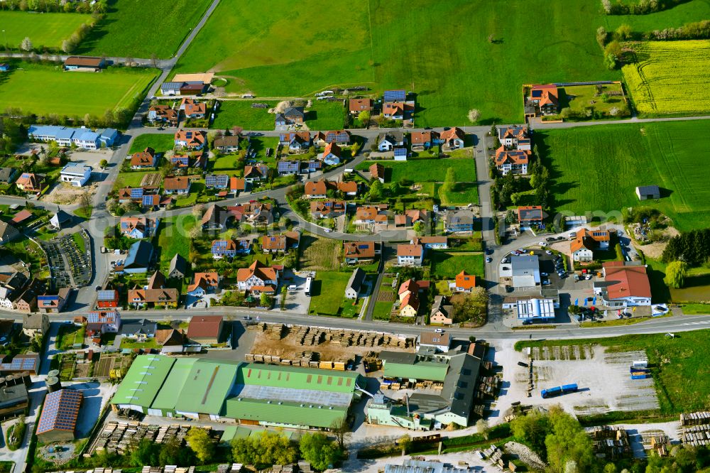 Geiselwind from above - Single-family residential area of settlement on the edge of agricultural fields in Geiselwind in the state Bavaria, Germany