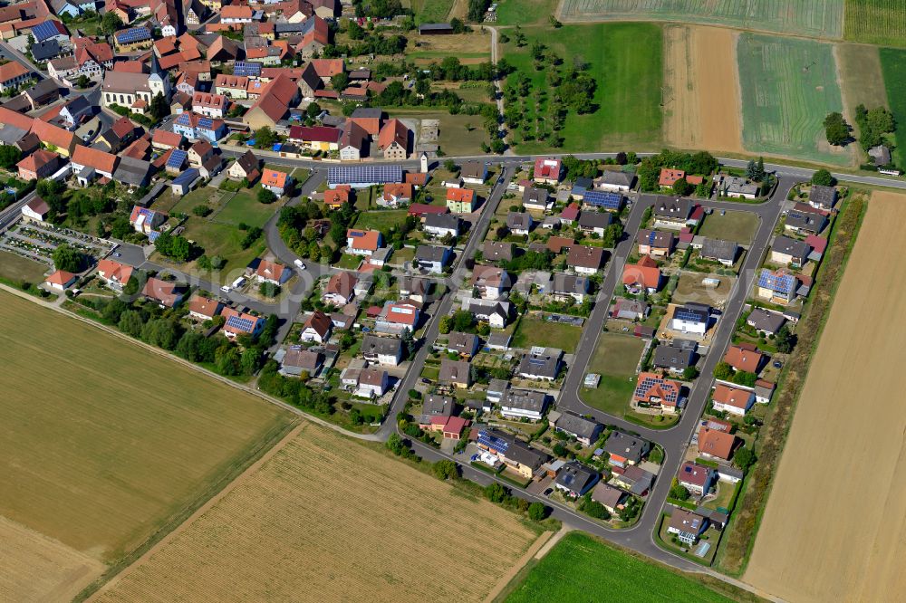 Gramschatz from the bird's eye view: Single-family residential area of settlement on the edge of agricultural fields in Gramschatz in the state Bavaria, Germany