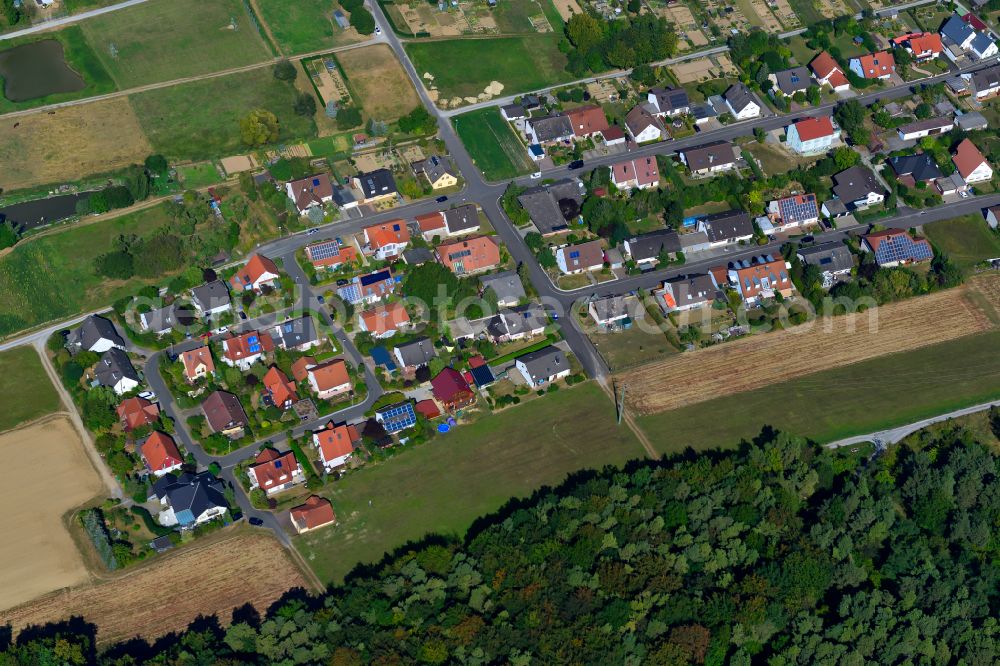 Greußenheim from above - Single-family residential area of settlement on the edge of agricultural fields in Greußenheim in the state Bavaria, Germany