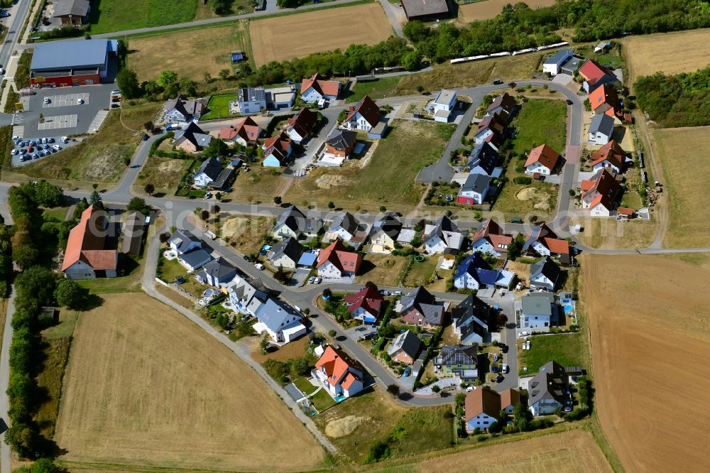 Holzkirchhausen from above - Single-family residential area of settlement on the edge of agricultural fields in Holzkirchhausen in the state Bavaria, Germany
