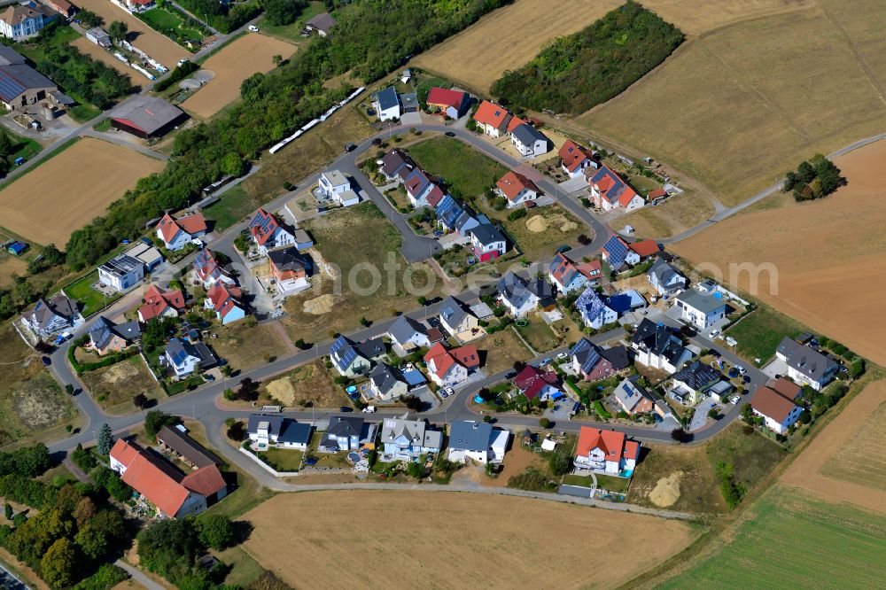 Holzkirchhausen from the bird's eye view: Single-family residential area of settlement on the edge of agricultural fields in Holzkirchhausen in the state Bavaria, Germany