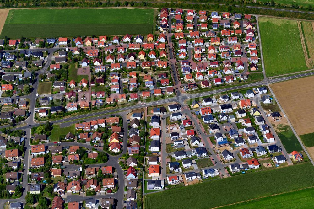 Aerial image Kürnach - Single-family residential area of settlement on the edge of agricultural fields in Kürnach in the state Bavaria, Germany