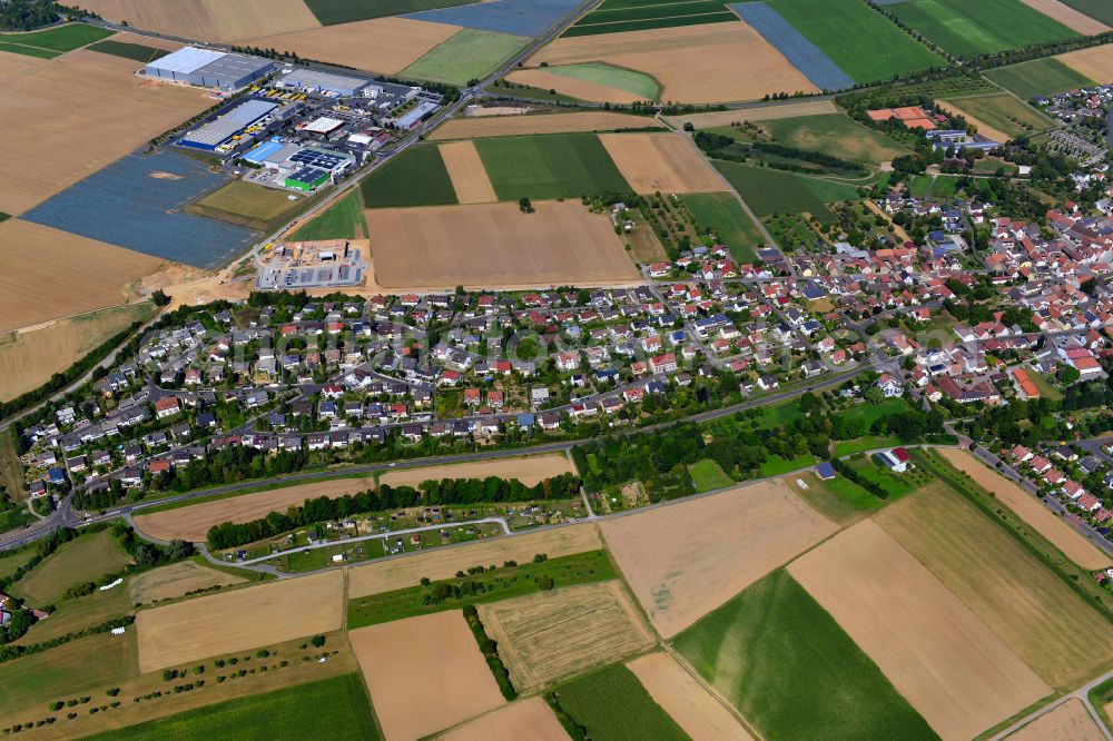 Kürnach from above - Single-family residential area of settlement on the edge of agricultural fields in Kürnach in the state Bavaria, Germany