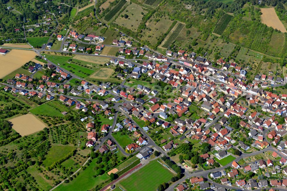 Leinach from above - Single-family residential area of settlement on the edge of agricultural fields in Leinach in the state Bavaria, Germany