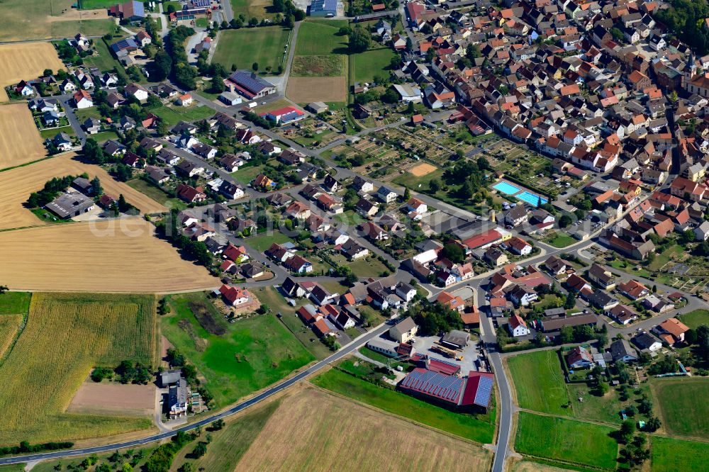 Aerial image Neubrunn - Single-family residential area of settlement on the edge of agricultural fields in Neubrunn in the state Bavaria, Germany