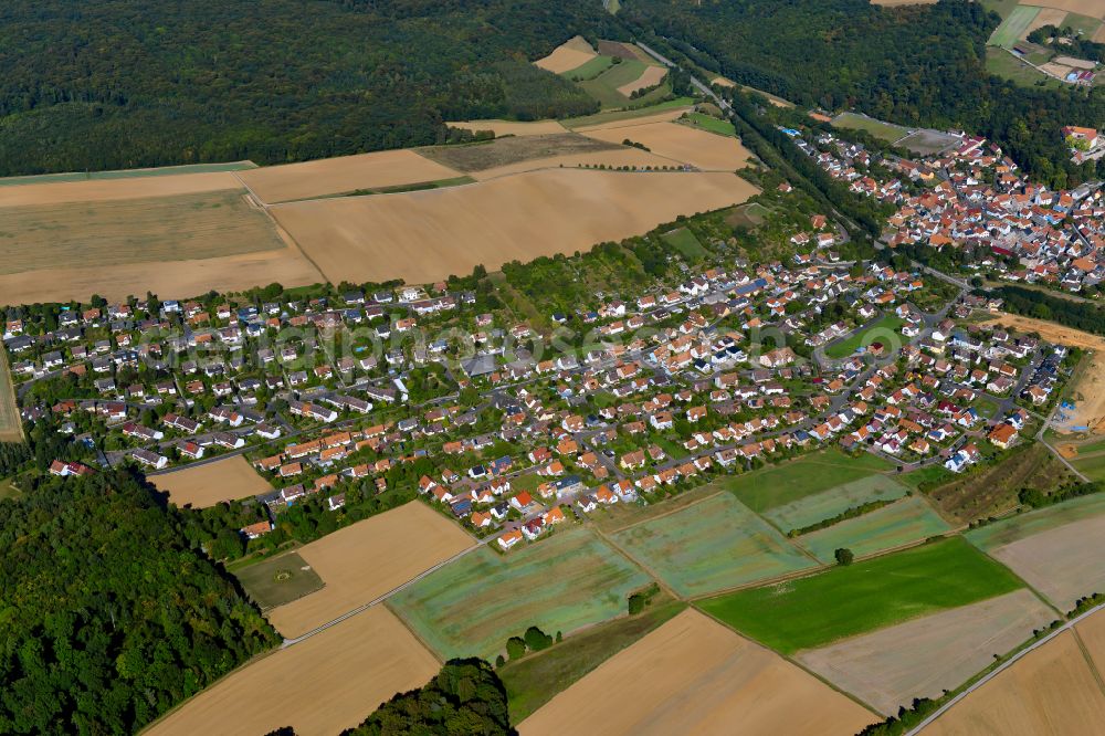 Reichenberg from above - Single-family residential area of settlement on the edge of agricultural fields in Reichenberg in the state Bavaria, Germany