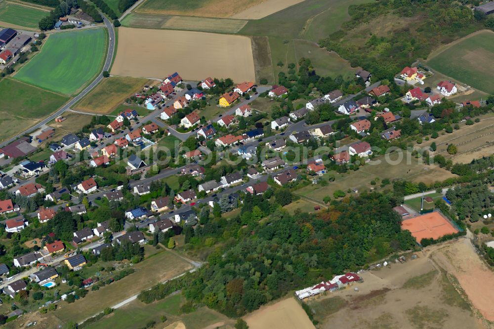 Remlingen from the bird's eye view: Single-family residential area of settlement on the edge of agricultural fields in Remlingen in the state Bavaria, Germany