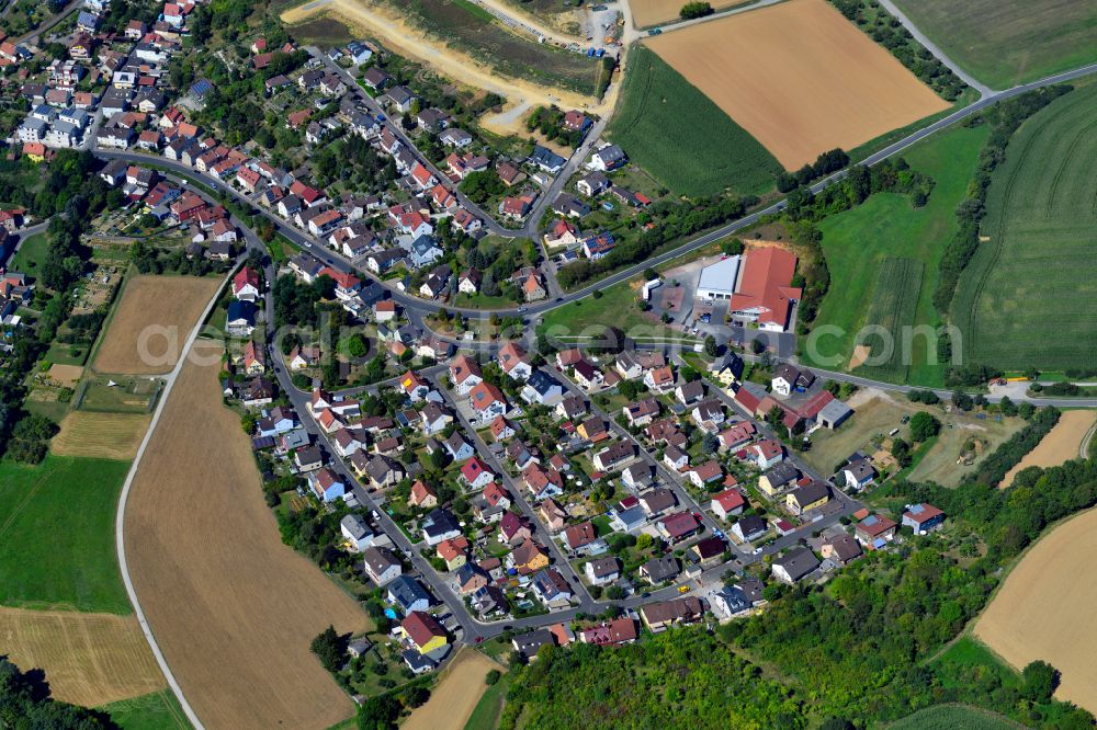 Rimpar from above - Single-family residential area of settlement on the edge of agricultural fields in Rimpar in the state Bavaria, Germany