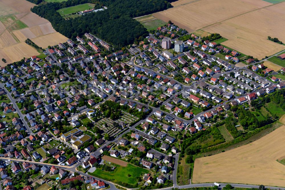 Rottendorf from the bird's eye view: Single-family residential area of settlement on the edge of agricultural fields in Rottendorf in the state Bavaria, Germany