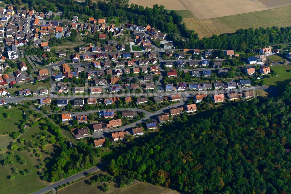 Tauberrettersheim from the bird's eye view: Single-family residential area of settlement on the edge of agricultural fields in Tauberrettersheim in the state Bavaria, Germany