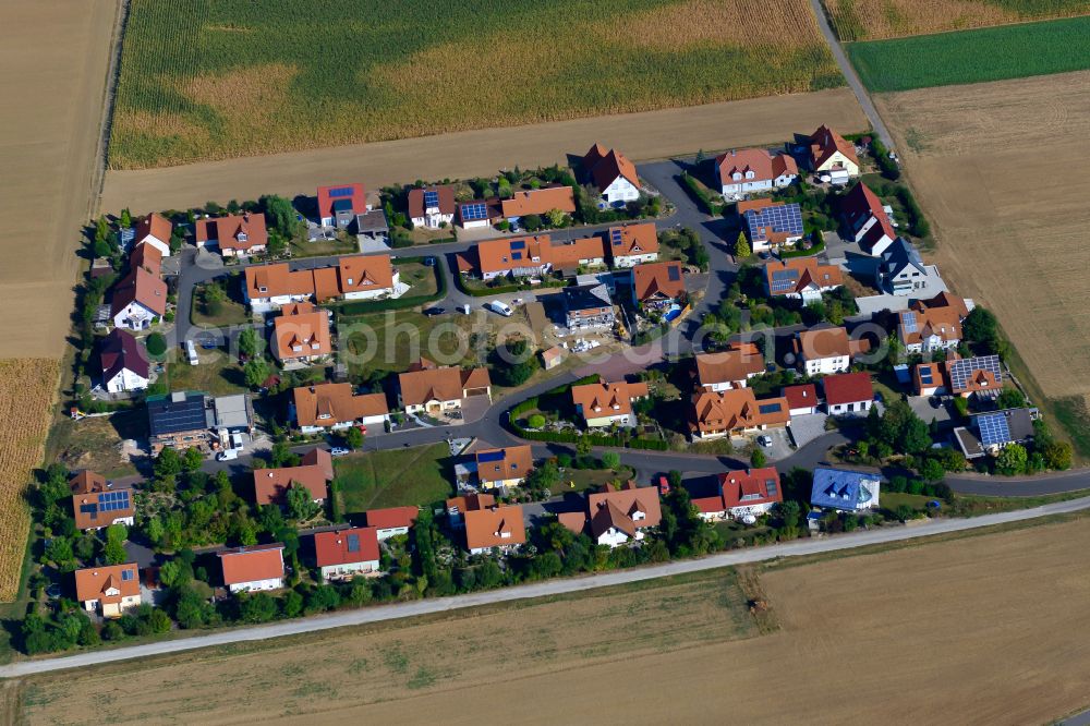 Aerial image Tauberrettersheim - Single-family residential area of settlement on the edge of agricultural fields in Tauberrettersheim in the state Bavaria, Germany