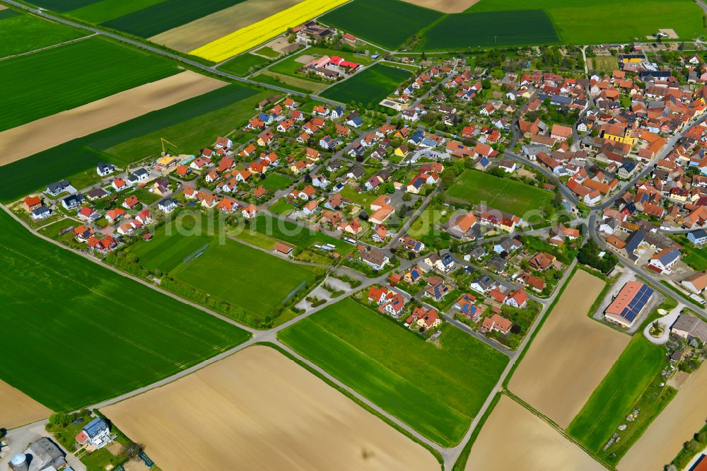 Willanzheim from the bird's eye view: Single-family residential area of settlement on the edge of agricultural fields in Willanzheim in the state Bavaria, Germany