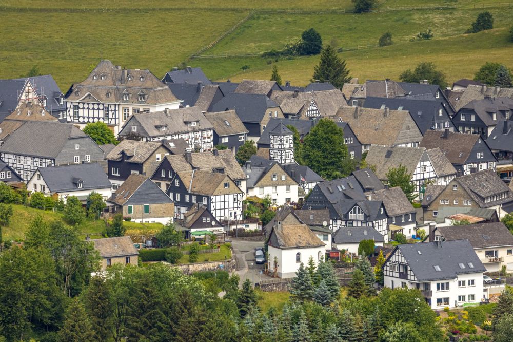 Eversberg from above - Residential areas on the edge of agricultural land in Eversberg at Sauerland in the state North Rhine-Westphalia, Germany