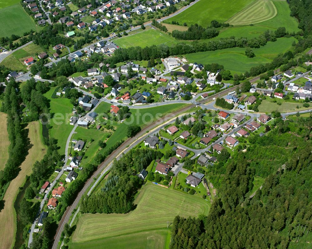 Förbau from above - Residential areas on the edge of agricultural land in Förbau in the state Bavaria, Germany