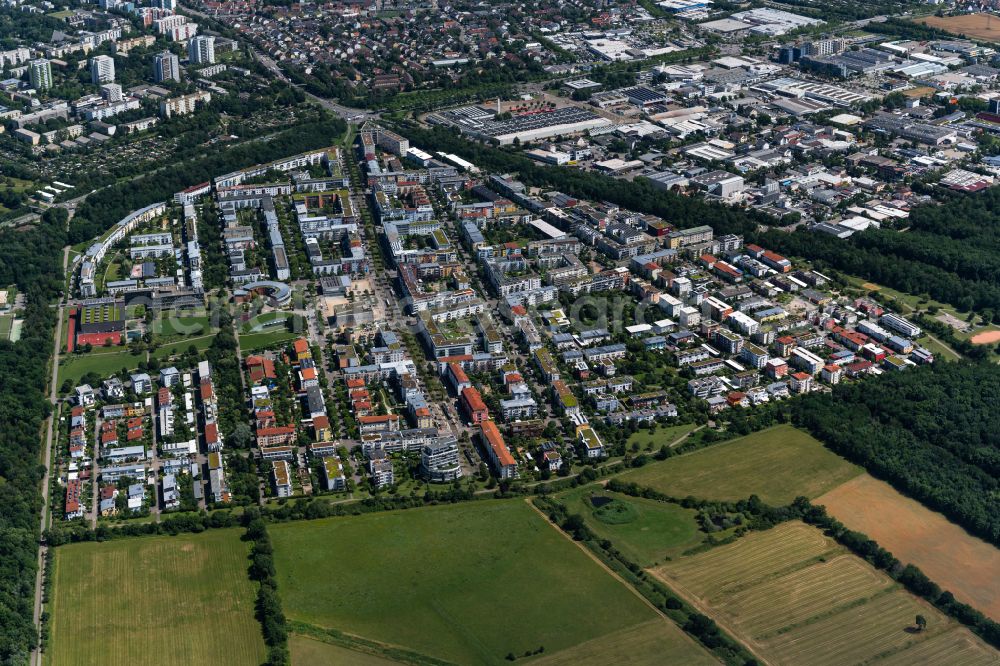Rieselfeld from the bird's eye view: Residential areas on the edge of agricultural land in Rieselfeld in the state Baden-Wuerttemberg, Germany