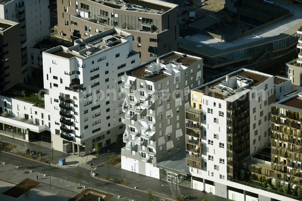 Saint-Ouen from above - Roof and wall structures in residential area of a multi-family house settlement at the Rue de Bateliers on the project site Les Docks in Saint-Ouen in Ile-de-France, France. A project of Bouygues Immobilier