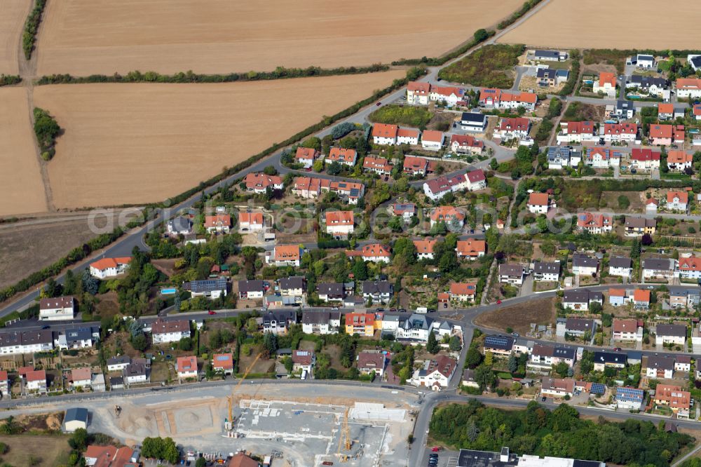 Arnstein from above - Residential area - mixed development of a multi-family housing estate and single-family housing estate in Arnstein in the state Bavaria, Germany