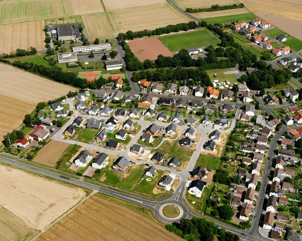 Holzheim from the bird's eye view: Residential area - mixed development of a multi-family housing estate and single-family housing estate in Holzheim in the state Hesse, Germany