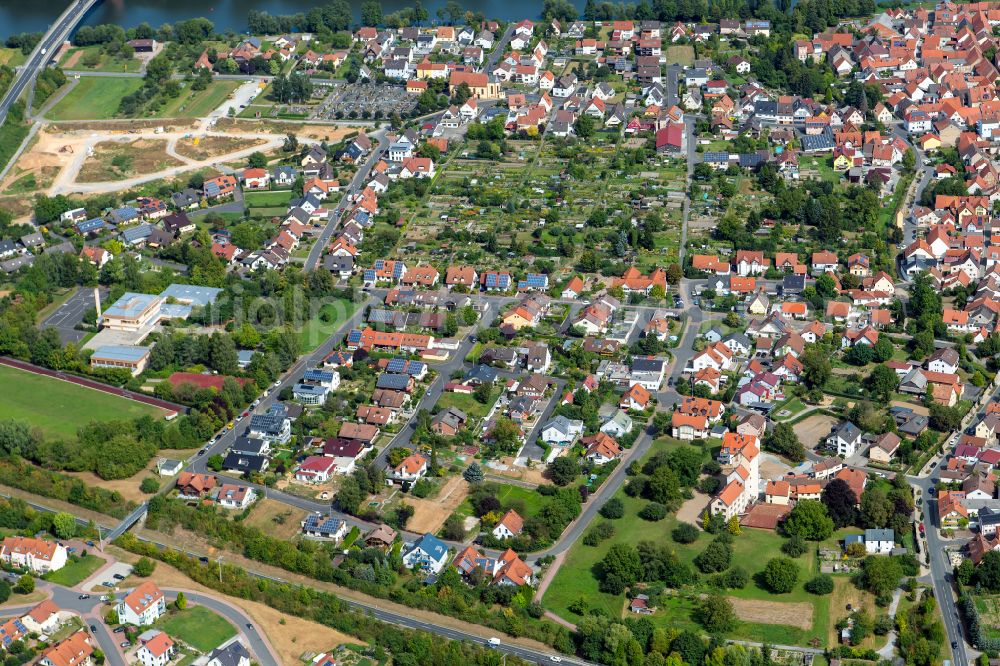 Retzbach from above - Residential area - mixed development of a multi-family housing estate and single-family housing estate in Retzbach in the state Bavaria, Germany
