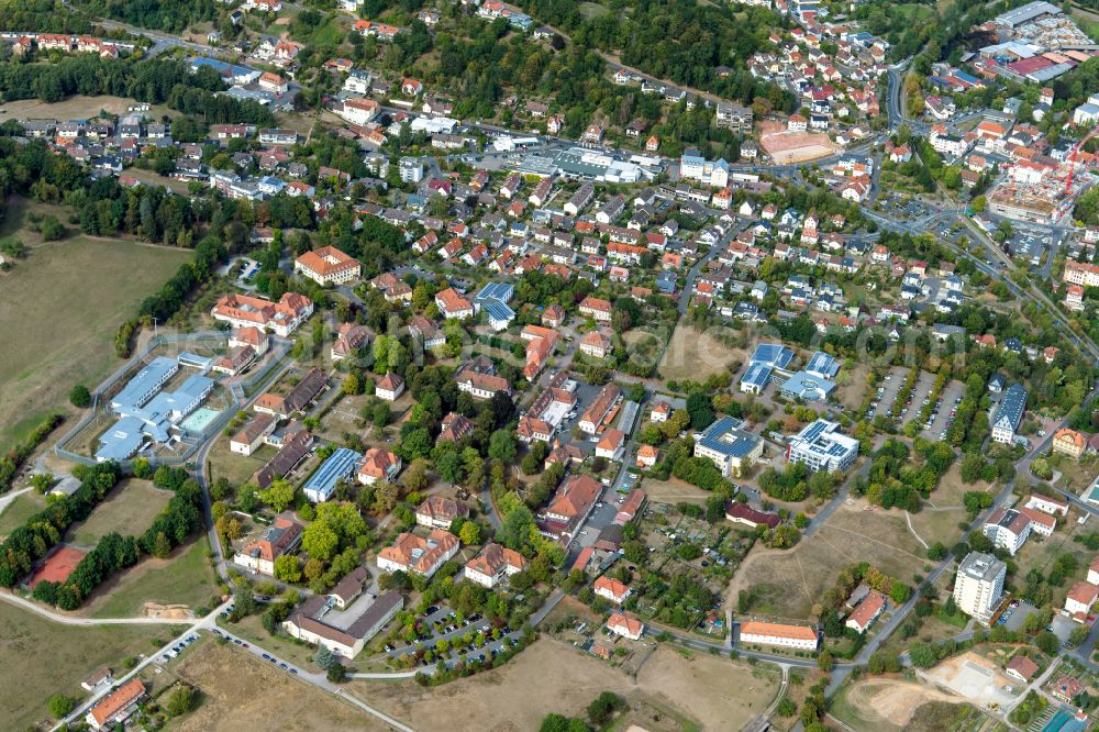 Wombach from the bird's eye view: Residential area - mixed development of a multi-family housing estate and single-family housing estate in Wombach in the state Bavaria, Germany