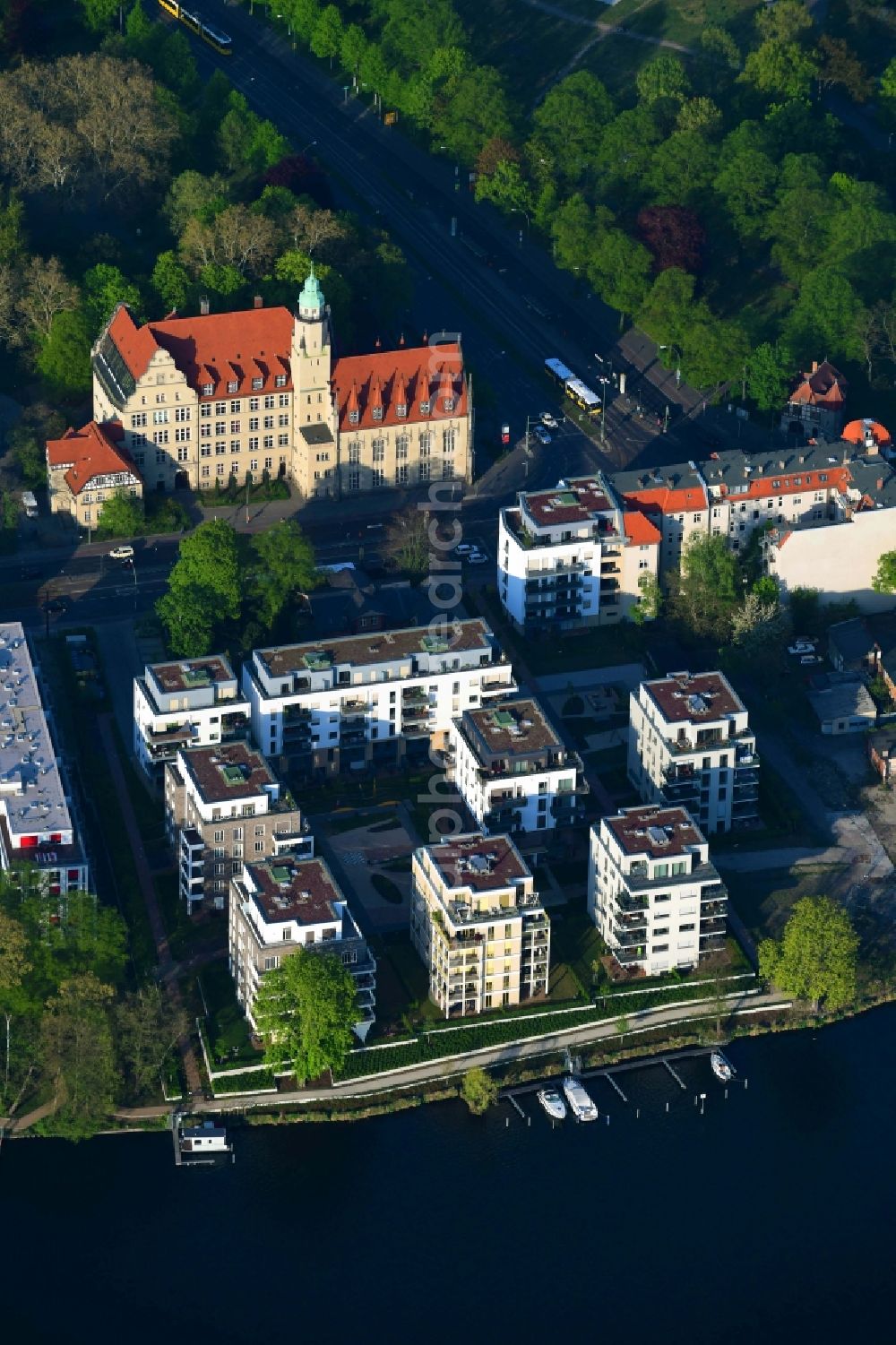 Berlin from above - Wintry snowy residential estate on the riverbank of the river Spree in the Koepenick part of the district of Treptow-Koepenick in Berlin in Germany