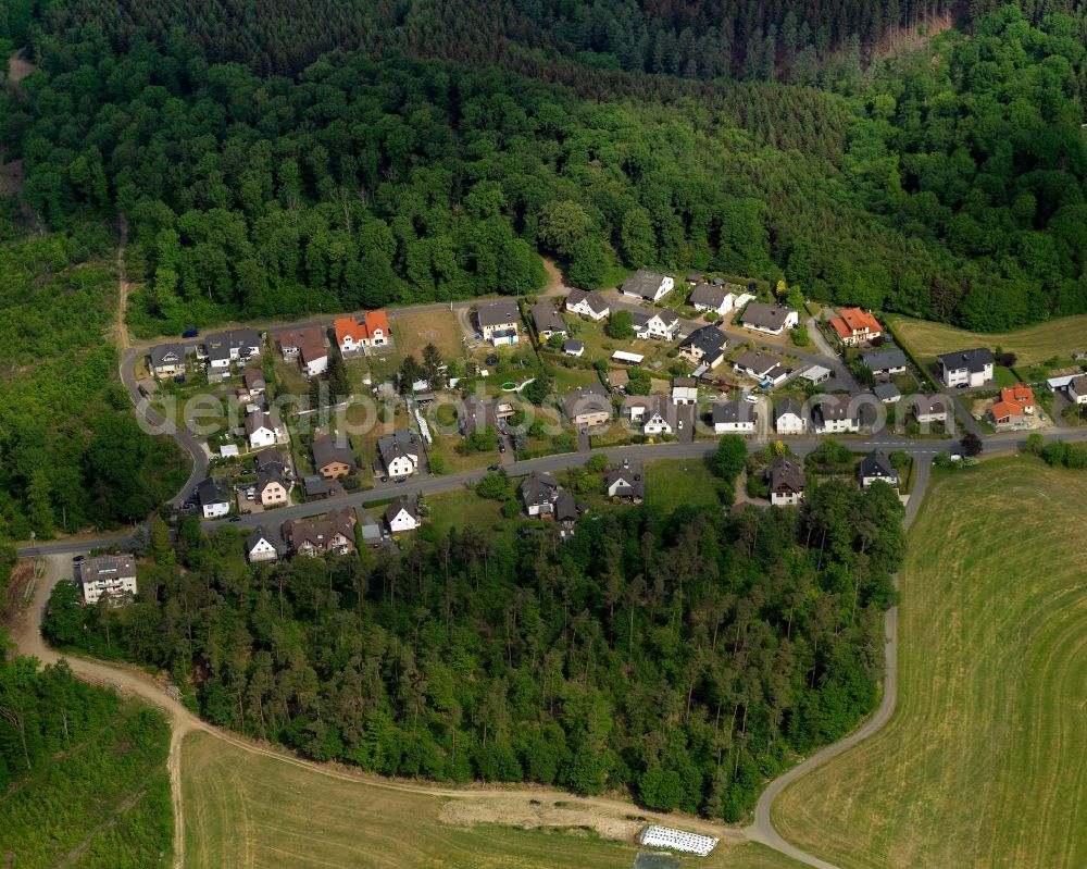 Birken-Honigsessen from above - Residential area between woods in the South of Birken-Honigsessen in the state of Rhineland-Palatinate. The centre of the municipiality consists of two separate but now connected villages: Birken and Honigsessen. The borough is located in the Wildenburger Land region and is surrounded by wooded hills and fields