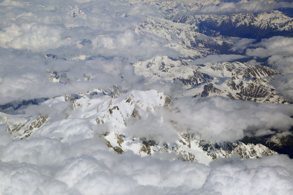 Aerial photograph Chamonix-Mont-Blanc - Clouds over the rock and mountain landscape in the high alps in Chamonix-Mont-Blanc in Auvergne-Rhone-Alpes, France
