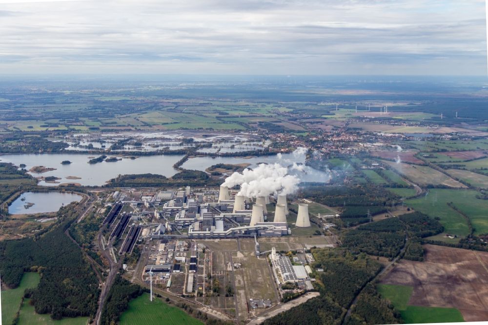 Teichland from the bird's eye view: Clouds of exhaust gas in the cooling towers of the power plant Jaenschwalde, a lignite-fired thermal power plant in southeastern Brandenburg. Power plant operator is to Vattenfall Europe belonging Vattenfall Europe Generation AG, which emerged from VEAG