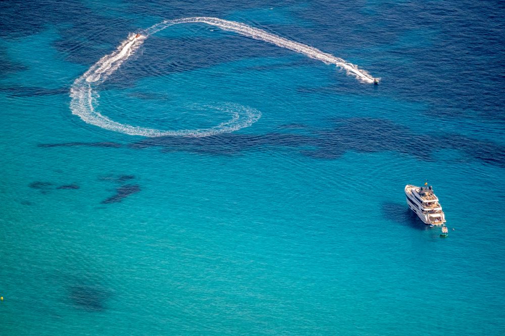 Aerial image Peguera - Luxury yacht on the sea on the water surface in on street Carrer Passerells in Peguera in Balearic islands, Spain