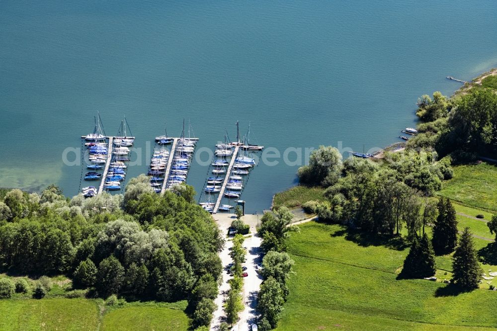 Breitbrunn am Chiemsee from the bird's eye view: Pleasure boat marina with docks and moorings on the shore area of Chiemsee in Breitbrunn am Chiemsee in the state Bavaria, Germany