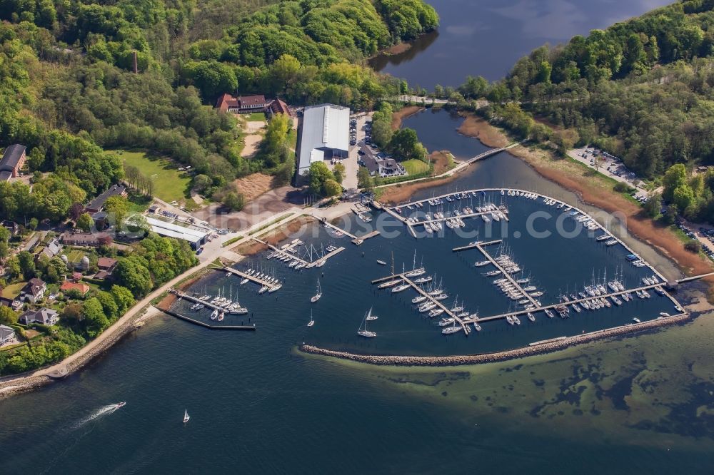 Glücksburg from the bird's eye view: Marina with pleasure craft moorings and boat berths on the shore area of the Flensburg Fjord in Gluecksburg in Schleswig-Holstein, Germany