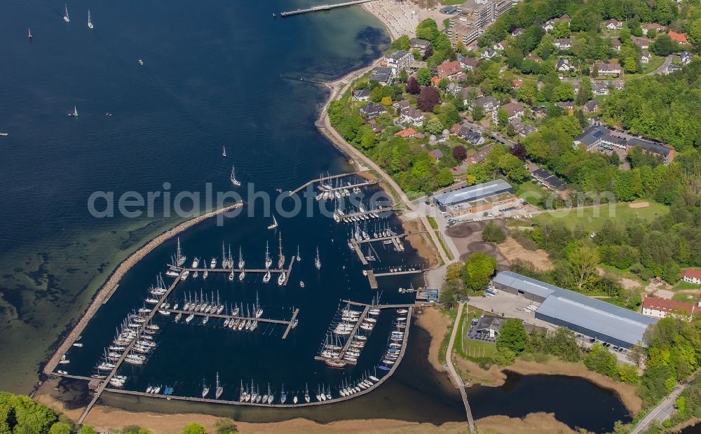 Glücksburg from the bird's eye view: Marina with pleasure craft moorings and boat berths on the shore area of the Flensburg Fjord in Gluecksburg in Schleswig-Holstein, Germany