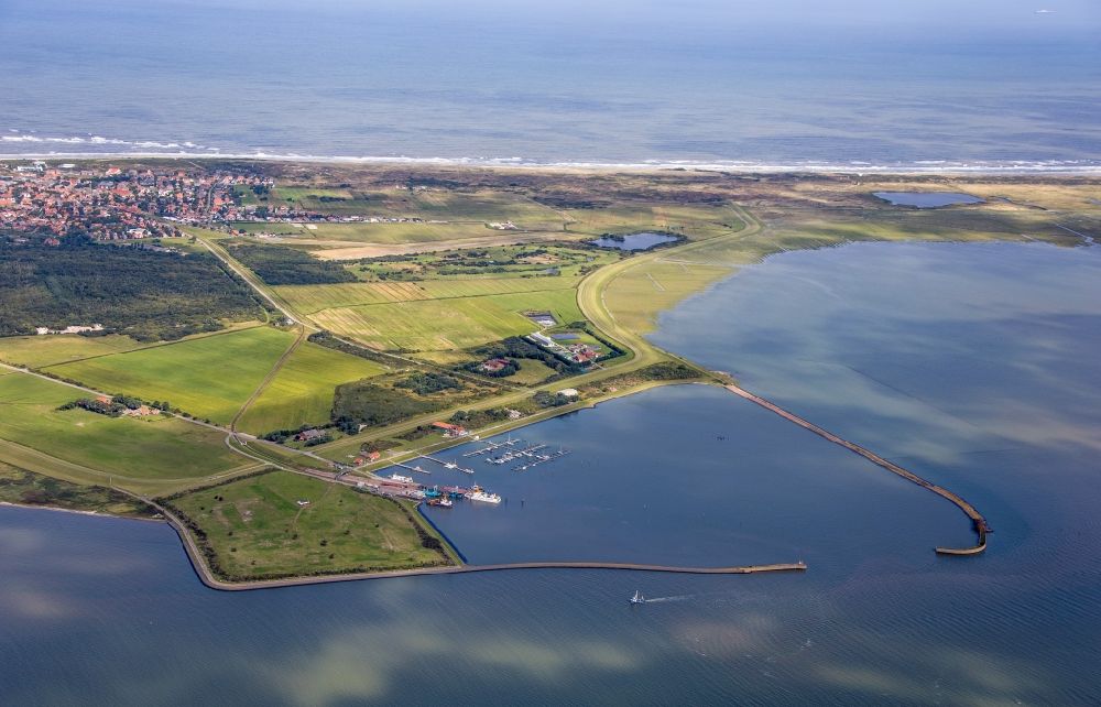 Langeoog from above - Pleasure boat marina with docks and moorings on the shore area on the coastal area of the North Sea in Langeoog in the state Lower Saxony, Germany
