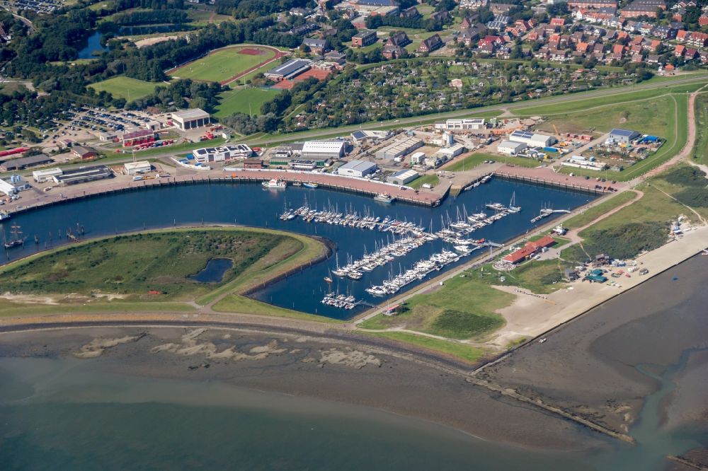 Norderney from above - Pleasure boat marina with docks and moorings on the shore area in Norderney in the state Lower Saxony, Germany
